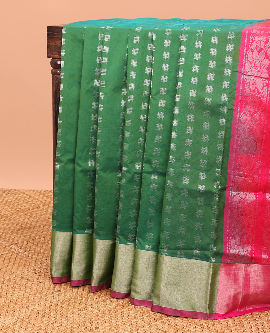 Green kupadam cotton saree with buttas, plain border & contrast pallu of intricate zari designs