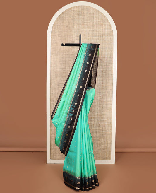 Turquoise zari buttas soft silk saree, contrast border of mayil chakram & kamalam designs & pallu of floral designs