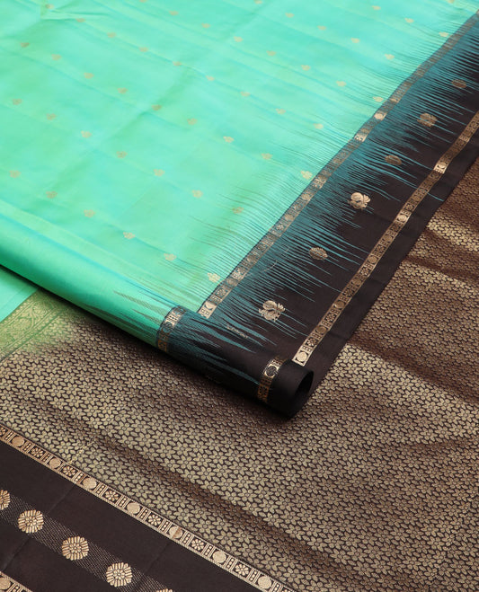Turquoise zari buttas soft silk saree, contrast border of mayil chakram & kamalam designs & pallu of floral designs