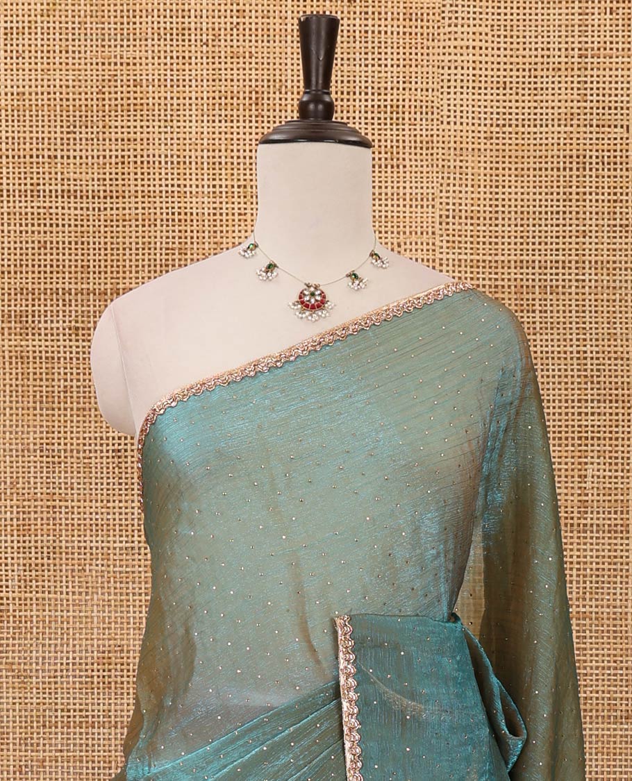 Peacock green Swarovski stone work embedded fendy-chiffon saree, scallop lace border & floral mixed embroidered blouse