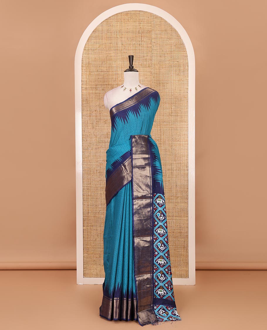Blue striped dola-tussar saree, contrast temple zari border, patola animal motifs enclosed jaal printed pallu & patola printed blouse