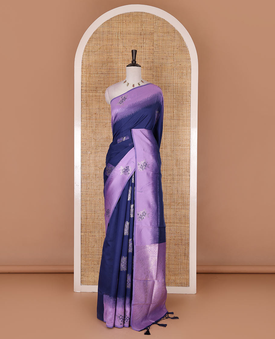 Navy blue-lavender floral buttas elite soft silk saree, contrast floral buttas border, and pallu of Mughal-style intricate zari designs