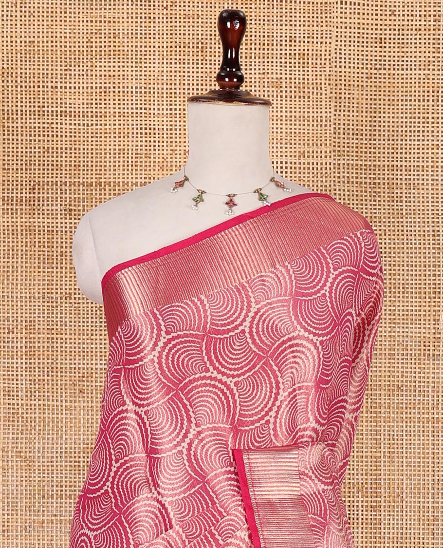 Rani pink scallop design tissue saree, zari striped border, striped pallu, and gleaming matching blouse