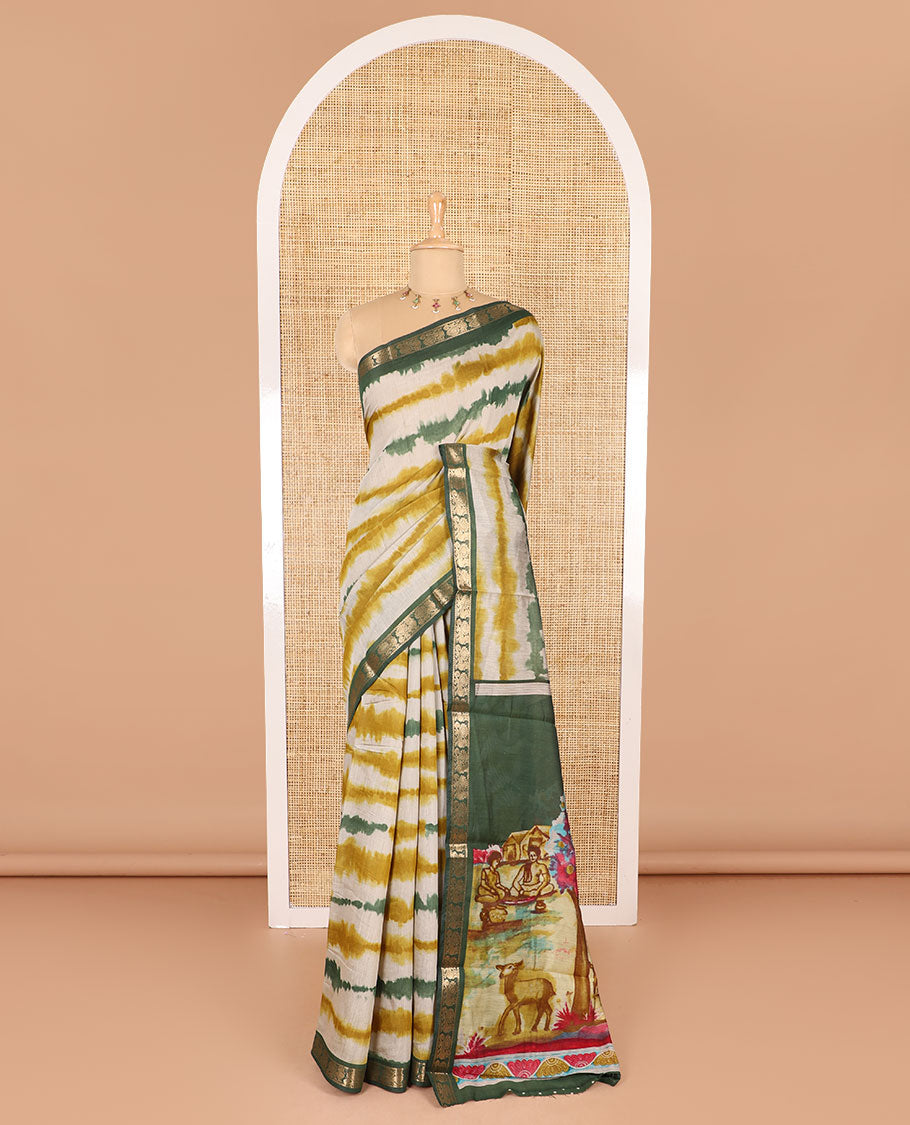 Mehendi green shibori printed muslin cotton saree, contrast peacock zari border, village scenery printed pallu, and a contrast polka dotted zari border blouse