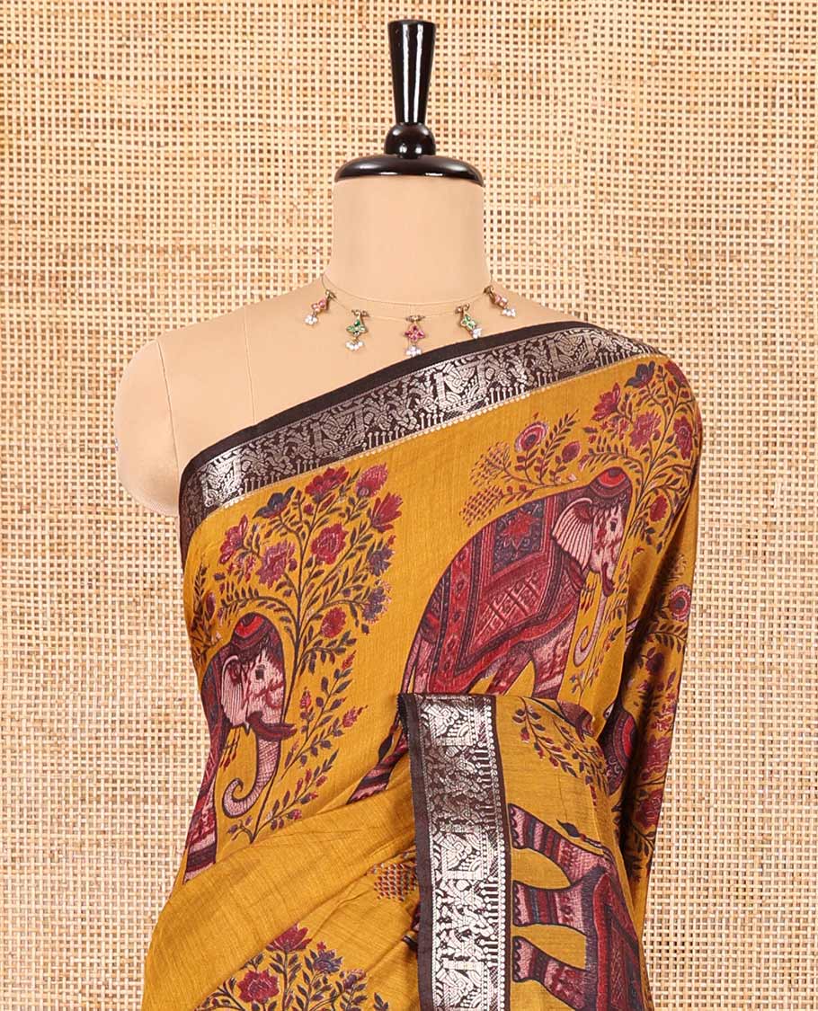 Mustard plain muslin cotton saree, contrast wedding-theme of floral and elephant motifs print, printed pallu, and a contrast buttas and zari bordered blouse