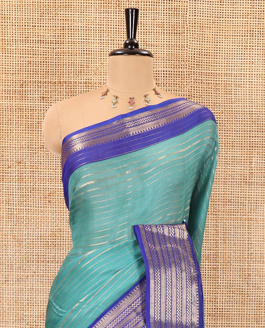 Rama horizontal zari striped moss chiffon saree, contrast traditional zari border, striped pallu, and a contrast zari design blouse