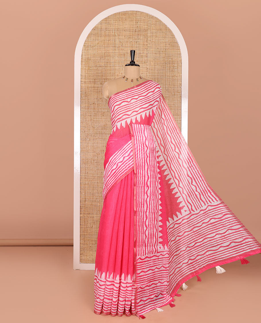 Pink plain linen cotton saree, temple zig-zag striped batik printed border, batik printed pallu, and triangle motifs batik printed blouse