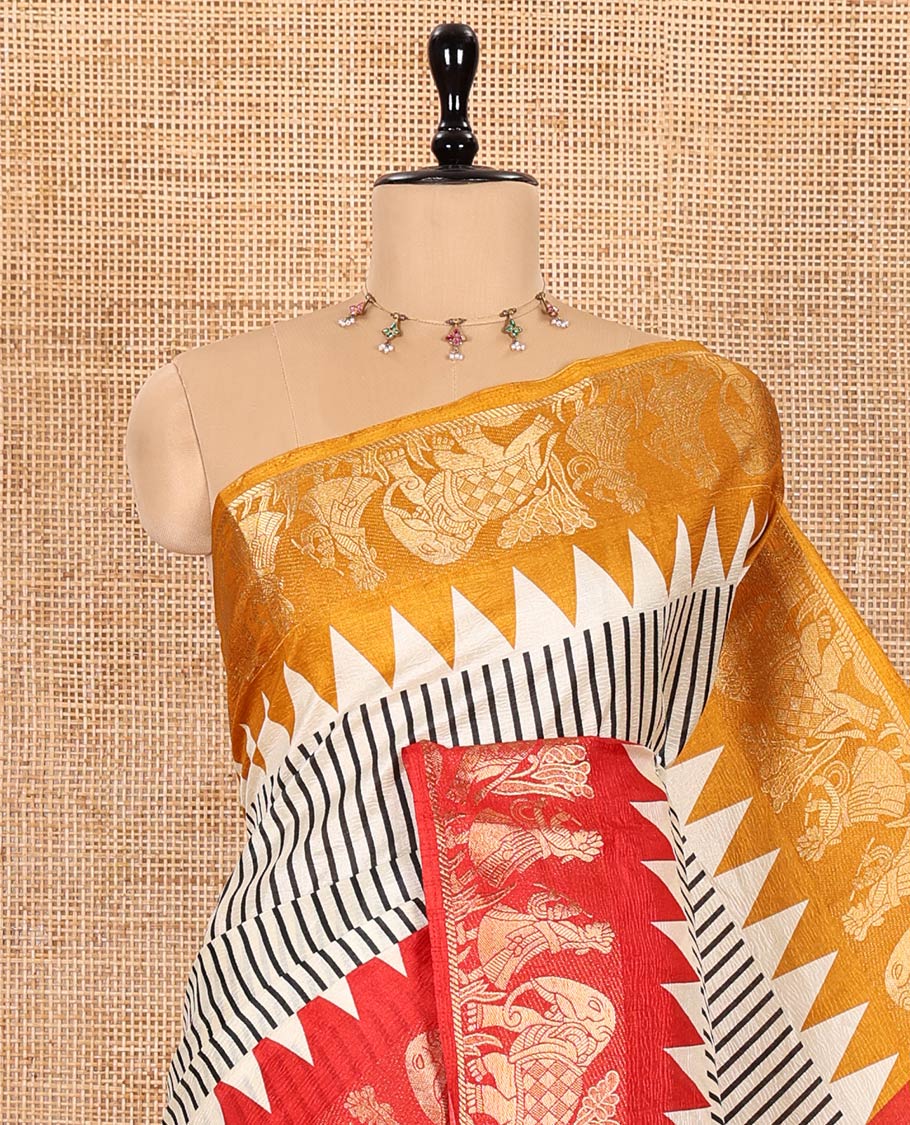 Chikku Base Dola Silk Saree Subtly Sparkled with Black Stripes All Over Its Body, Complemented by a Contrast Ganga-Jamuna Border of Human Figurines and Elephant Motifs, Pallu of Floral-Paisley Print, and Paired with a Contrast Blouse