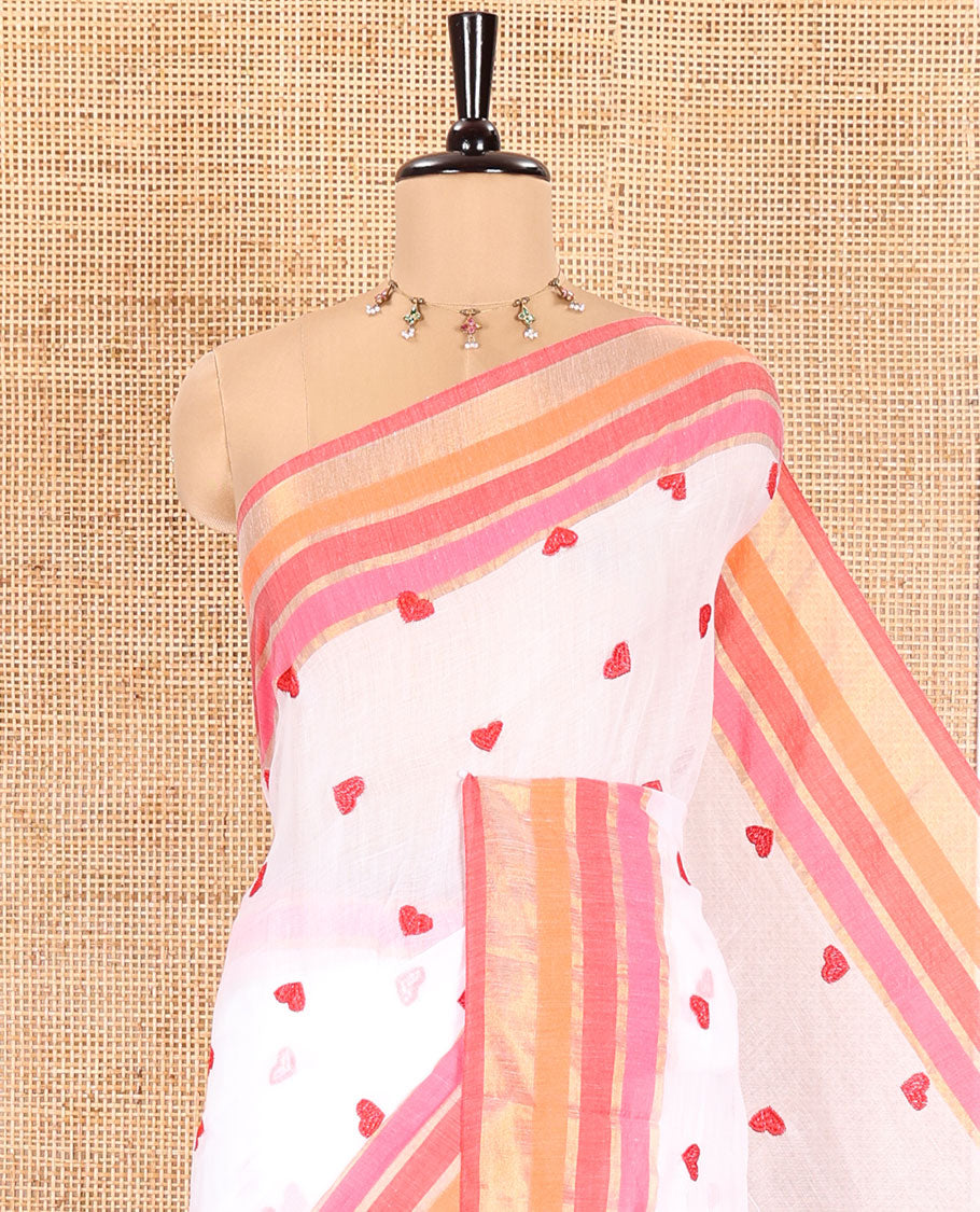 White Khadi Mul Cotton Saree, Artfully Designed Heart Motifs Embroidered on Its Body, Complemented by a Contrast Multi-Colored Striped Border, Pallu Steeped with Heart Motifs Embroidery, and Paired with a Matching Blouse