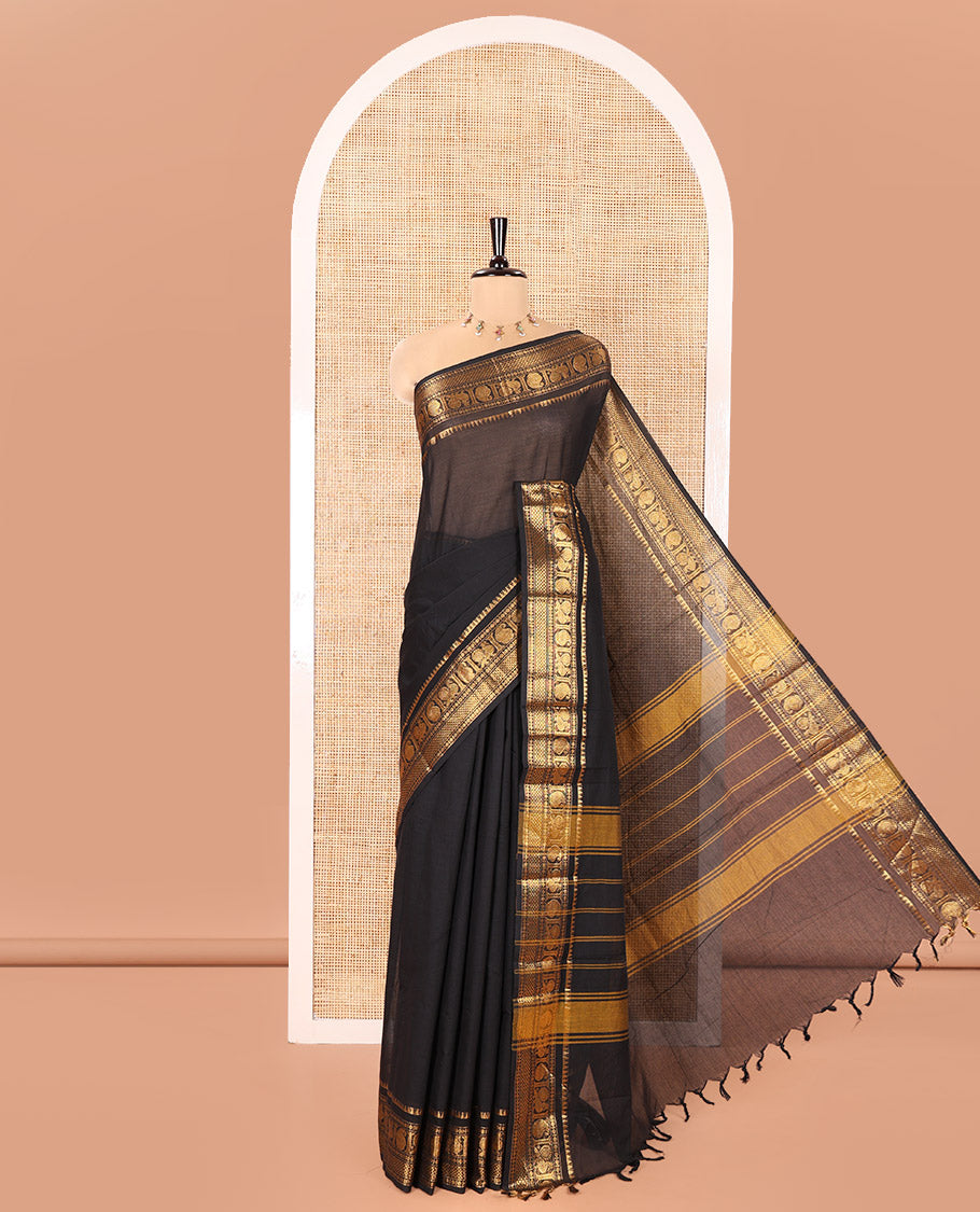 Black Plain Chettinad Cotton Saree, Highlighted by a Zari Traditional Border of Peacock and Paisley Designs, Subtly Striped Pallu, and Paired with a Matching Blouse