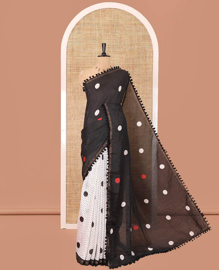 Black Chanderi Cotton Saree, Steeped with Small and Big Polka Dots on Its Body, Subtle Pom-Pom Tasseled Border, a Self-Pallu, and Paired with a Contrast Blouse
