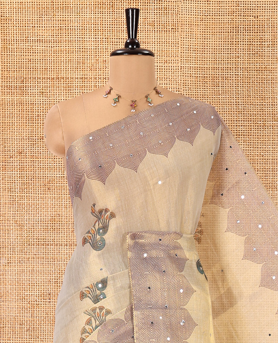 Cream Tissue Saree, Ornamented with Floral Buttas and Mirrorwork, a Self-Border, Ogee Print Pallu, and a Matching Blouse