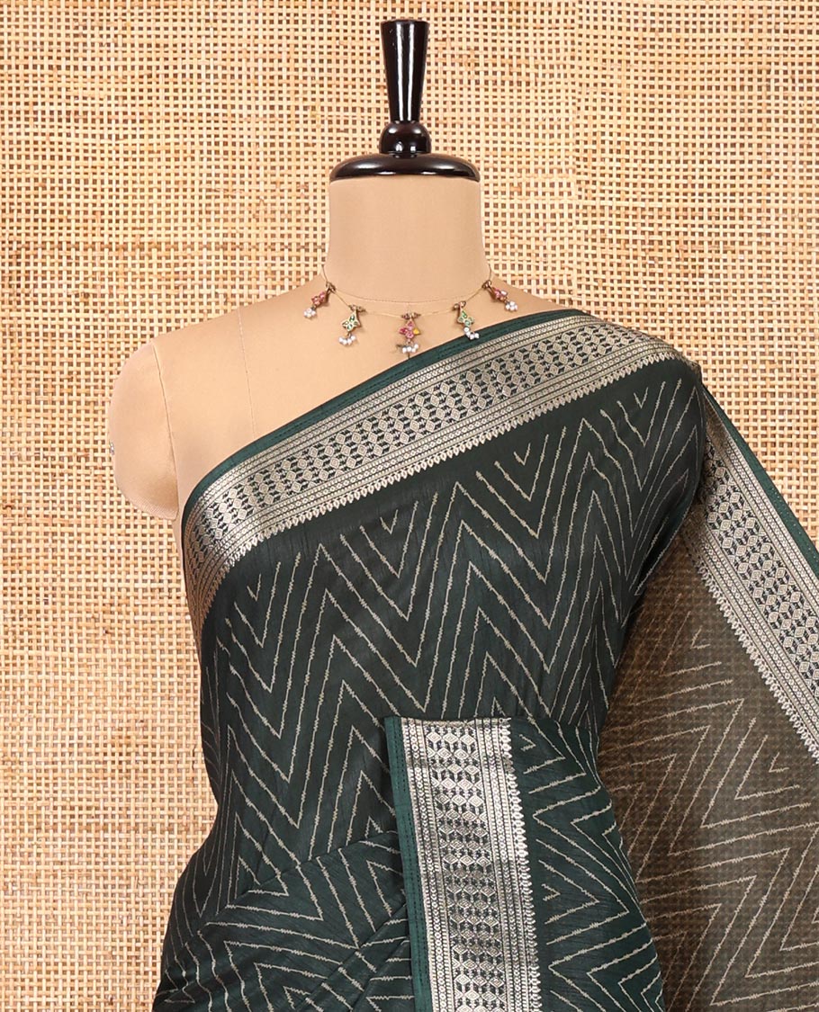 Green Dola Silk Saree, Subtly Sparkled with Chevron Stripes on Its Body, Highlighted by Traditional Zari Design Border, Intricately Designed Pallu, and Paired with a Matching Blouse