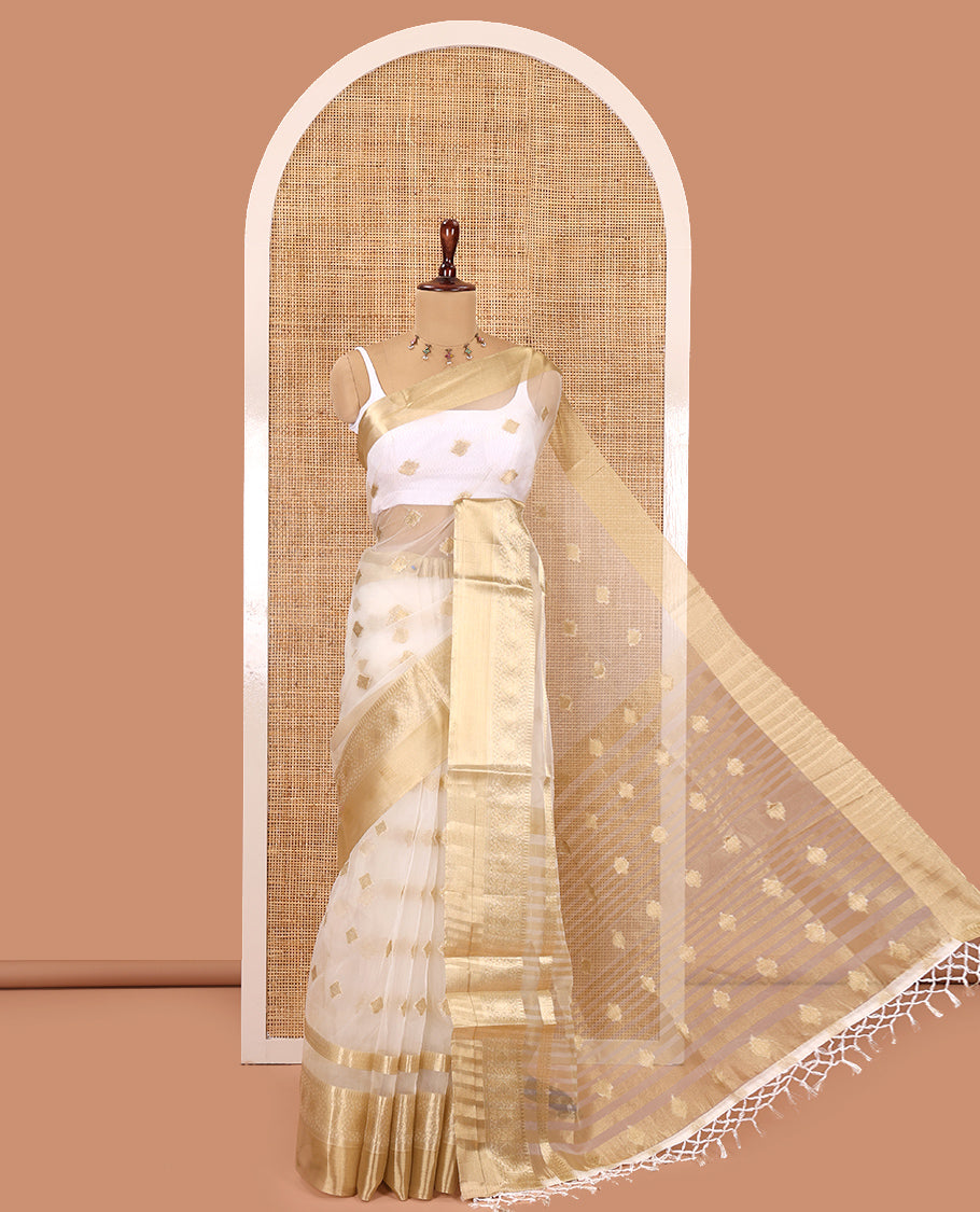Cream Semi-Organza Saree, Subtly Enriched with Zari Buttas, Highlighted by a Zari Traditional Border, and a Matching Blouse