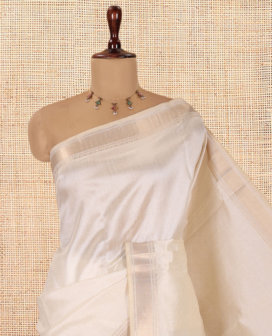 Cream Plain Semi-Tussar Saree, a Zari Traditional Border, a Self-Pallu, and a Matching Blouse