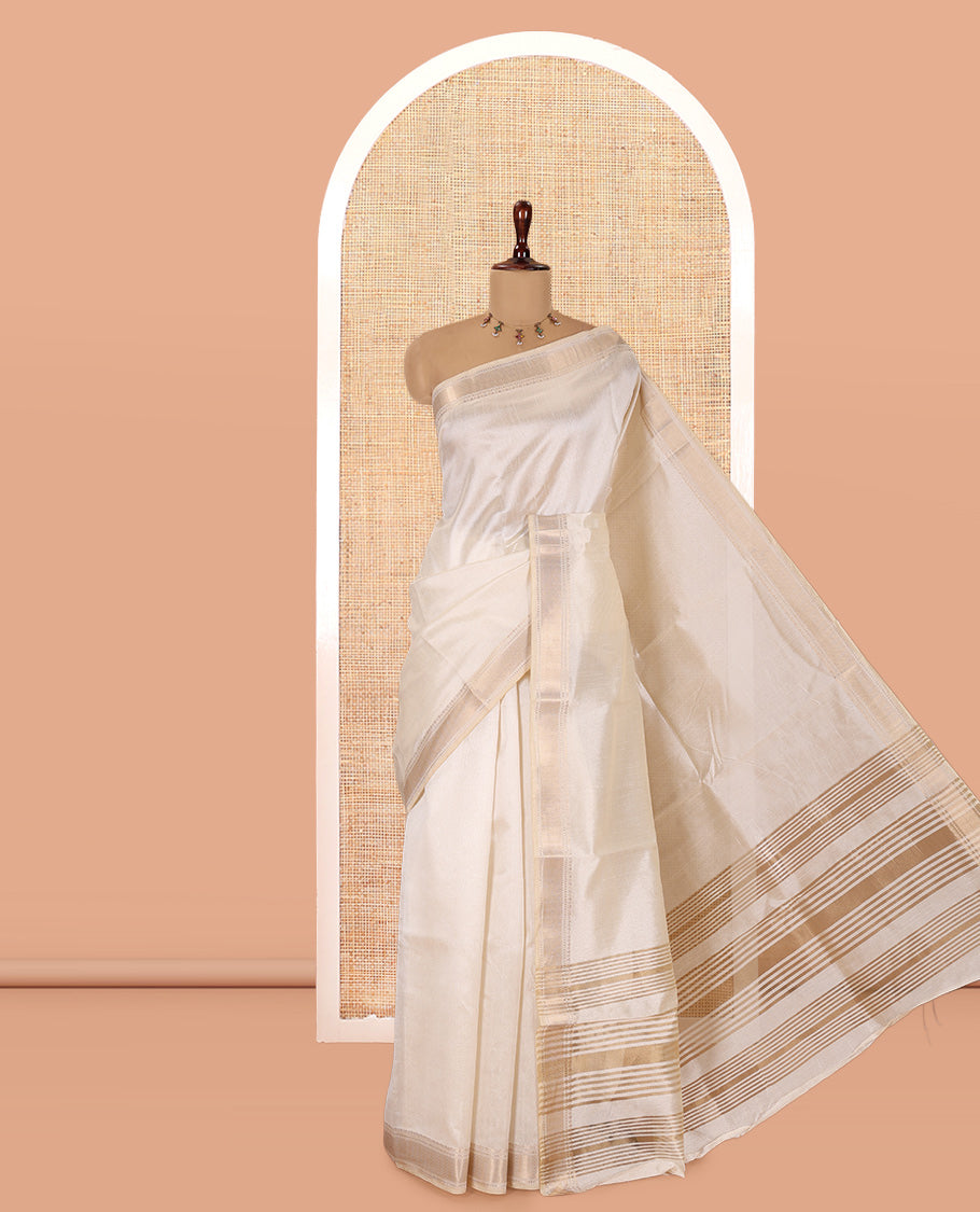 Cream Plain Semi-Tussar Saree, a Zari Traditional Border, a Self-Pallu, and a Matching Blouse