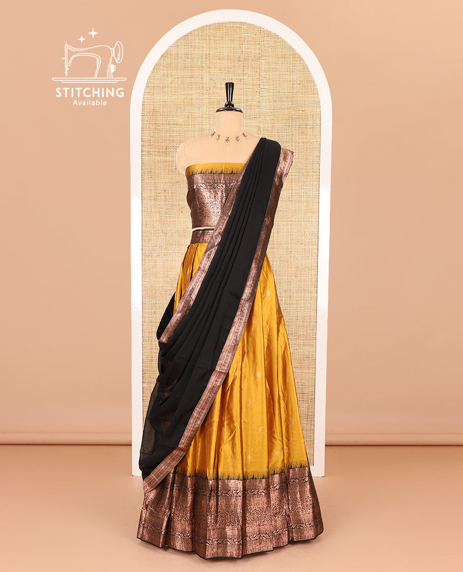 Yellow half-saree, zari buttas with contrast traditional zari bordered skirt, matching blouse and a contrast zari border dhavani