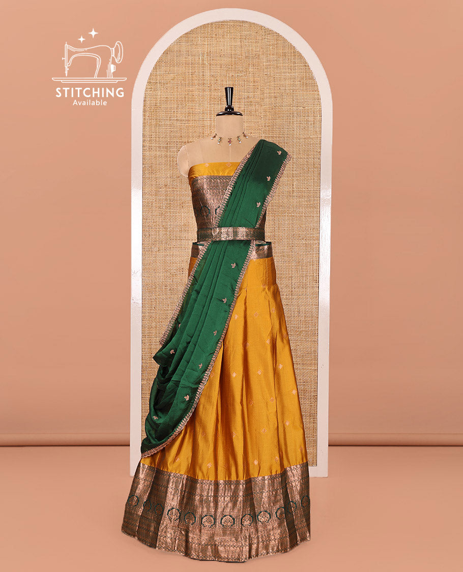 Yellow and Green Semi-Banarasi Half-Saree Prettified with Zari Buttas on Its Skirt, Complemented by a Contrast Traditional Zari Design Steeped Border, Paired with a Matching Blouse, and a Satin Georgette Embroidered Scallop Dhavani