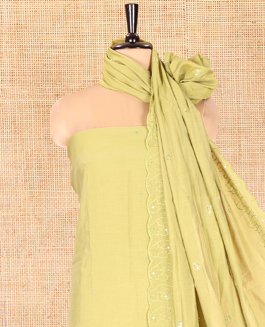 Green Mul Chanderi Material Chudidar Set, Accentuated with Appliqué Floral Embroidery on Its Top, a Plain Santoon Bottom, and Paired Scallop Embroidered Mul Chanderi Dupatta