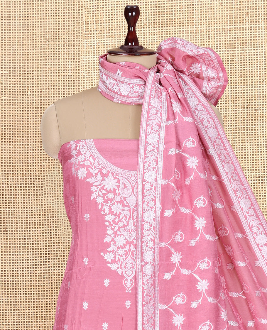 Peach Viscose Muslin Material Churidar Features Buttas Thread Woven Top, a Santoon Bottom, and Floral Jaal Dupatta