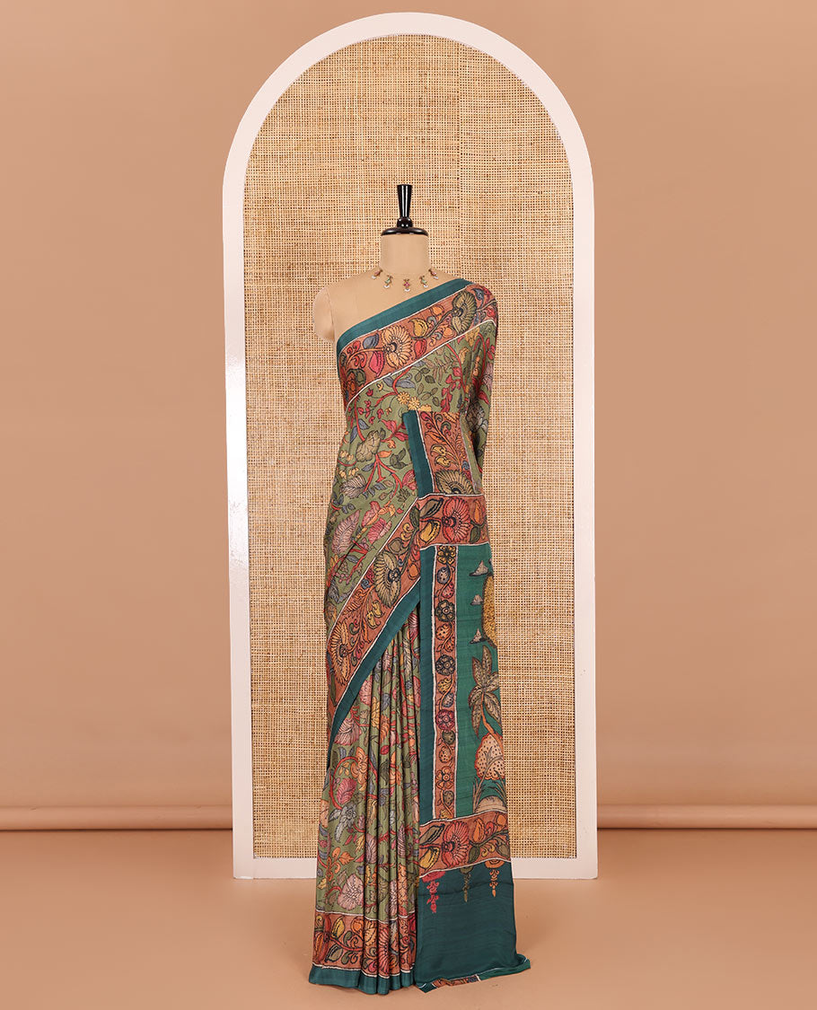 Leaf green kalamkari floral vine printed Italian crepe saree, contrast kalamkari floral creeper printed border, pallu of Pichwai and kalamkari print, and a plain blouse