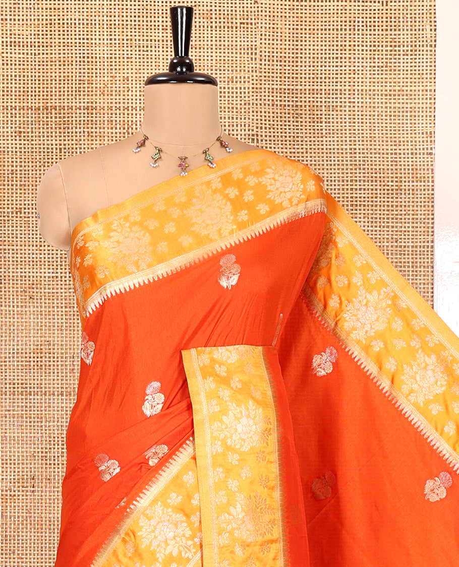 Orange Fancy Raw Silk Saree, Detailed with Floral Zari Buttas, a Contrast Floral Temple Border, Intricate Pallu, and a Contrast Blouse