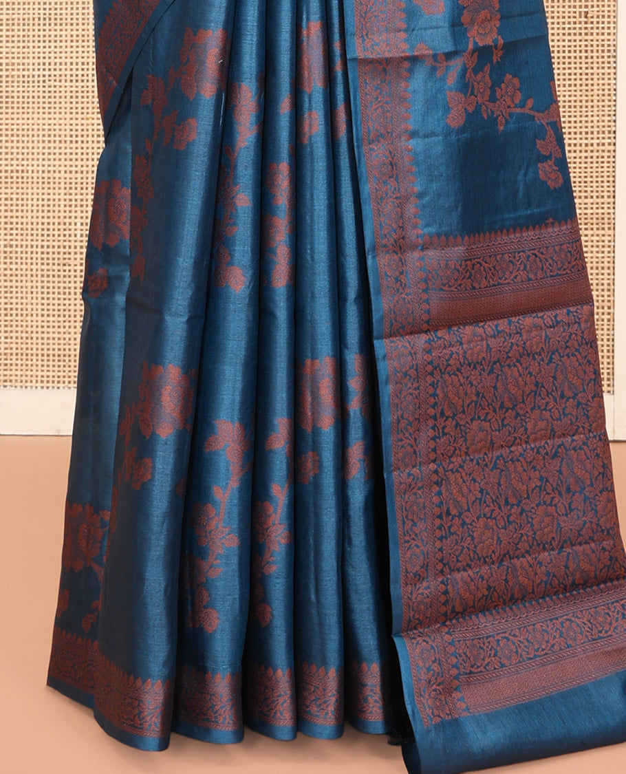 Blue Tussar Silk Saree Features Floral Designs, Sparsely Woven Zari Border, Intricately Designed Pallu, and a Matching Blouse