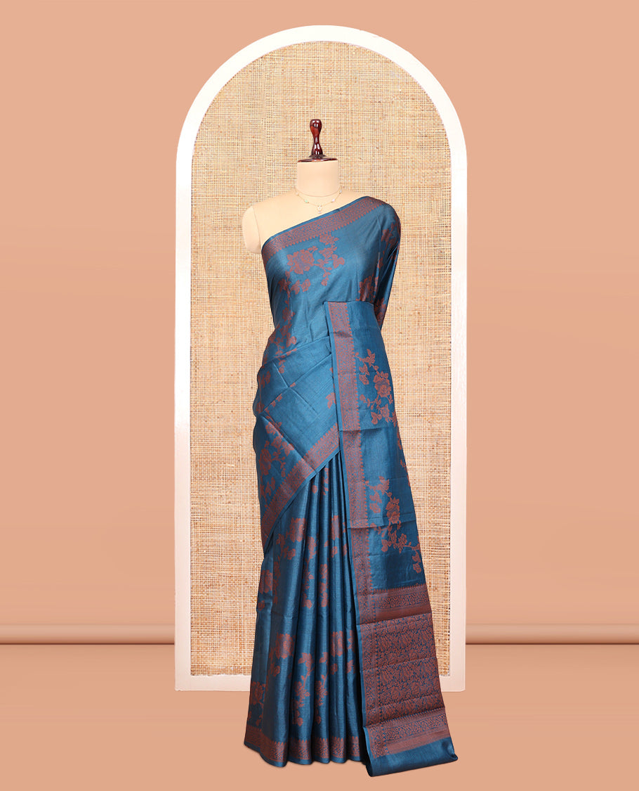 Blue Tussar Silk Saree Features Floral Designs, Sparsely Woven Zari Border, Intricately Designed Pallu, and a Matching Blouse
