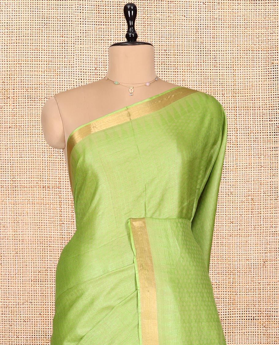 Parrot Green Sparsely Textured Tussar Silk Saree, a Subtle Piping Border, a Self-Pallu, and a Matching Blouse