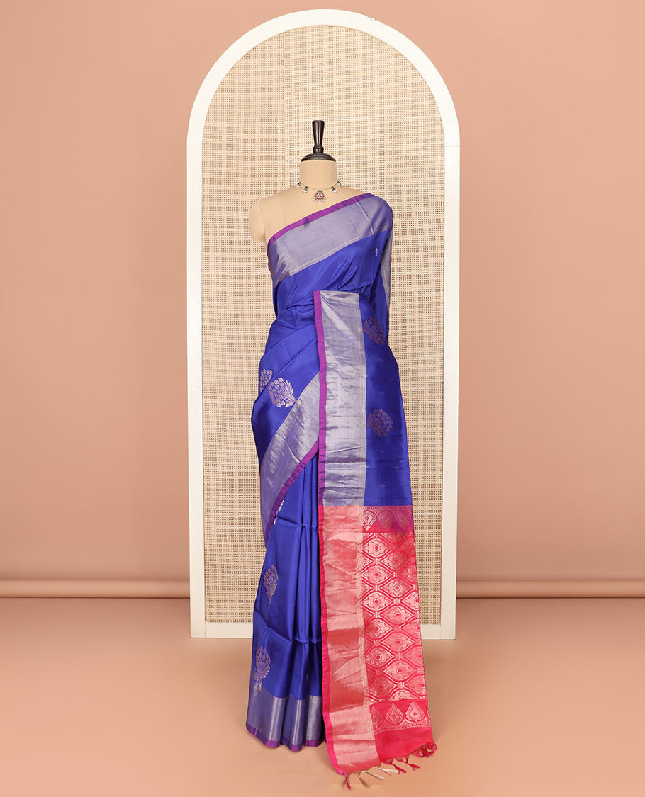 Blue Semi Uppada Saree Gracefully Embellished with Zari Buttas, Complemented by a Contrasting Bavanji Border, Pallu of Intricate Ogee Designs, and Paired with a Contrast Blouse