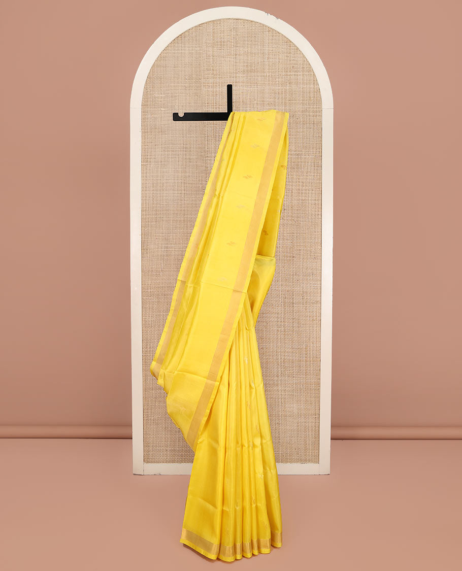Yellow Uppada Silk Saree, Sparsely Woven with Buttas All Over Its Body, Subtle Bavanji Border, Pallu Steeped with Paisley Buttas, and Paired with a Matching Blouse