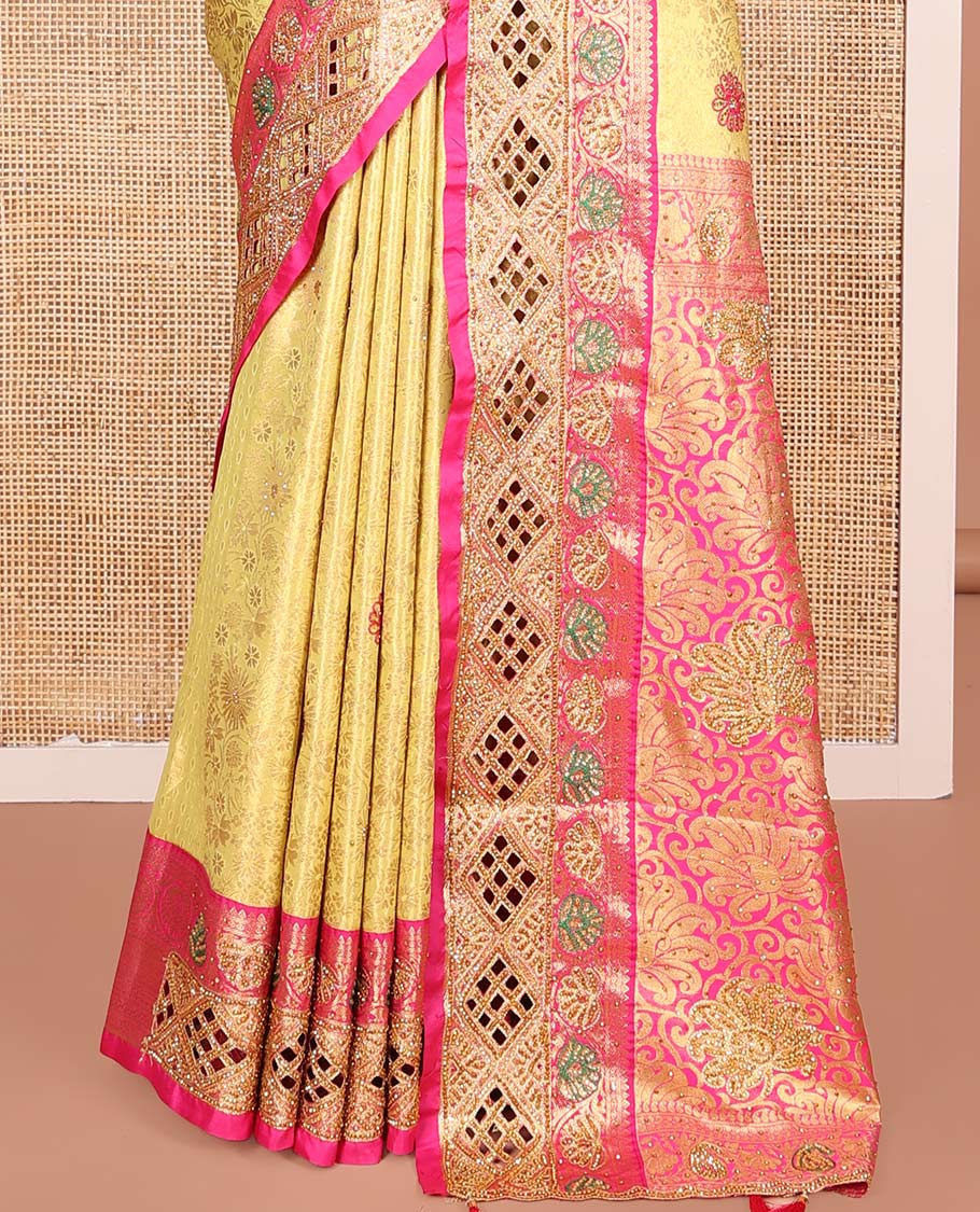 Yellow Vastrakala Silk Saree, Highlighted with Jacquard and Embroidery Work, Complemented by Contrast Zari and Cut Embroidered Border, Gleaming Floral Jaal Stone Work Pallu, and Paired with Contrast Heavy Embroidered Blouse