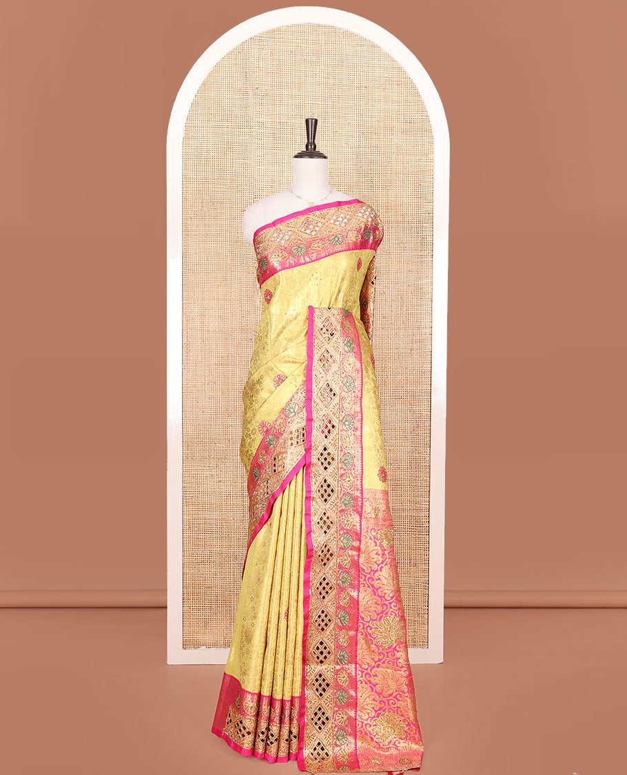 Yellow Vastrakala Silk Saree, Highlighted with Jacquard and Embroidery Work, Complemented by Contrast Zari and Cut Embroidered Border, Gleaming Floral Jaal Stone Work Pallu, and Paired with Contrast Heavy Embroidered Blouse