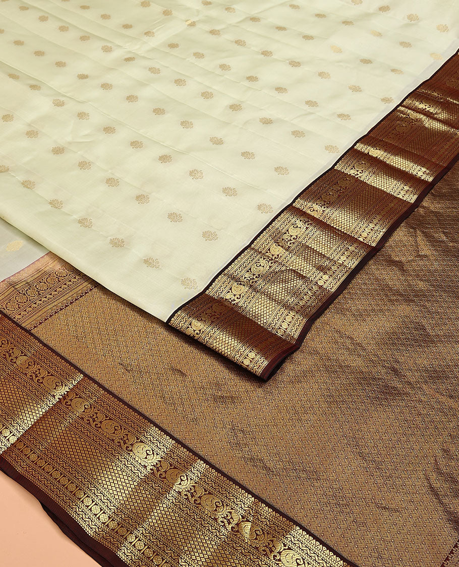 Cream Vasundhara Lite Silk Mix Saree, Enthralled with Zari Buttas on Its Body, Complemented by Contrast Border of Muthu, Banaras, Neli, Manga, Mayil Kann, and Rudraksham Designs, Grand Jaal Pallu, and Paired with a Contrast Blouse