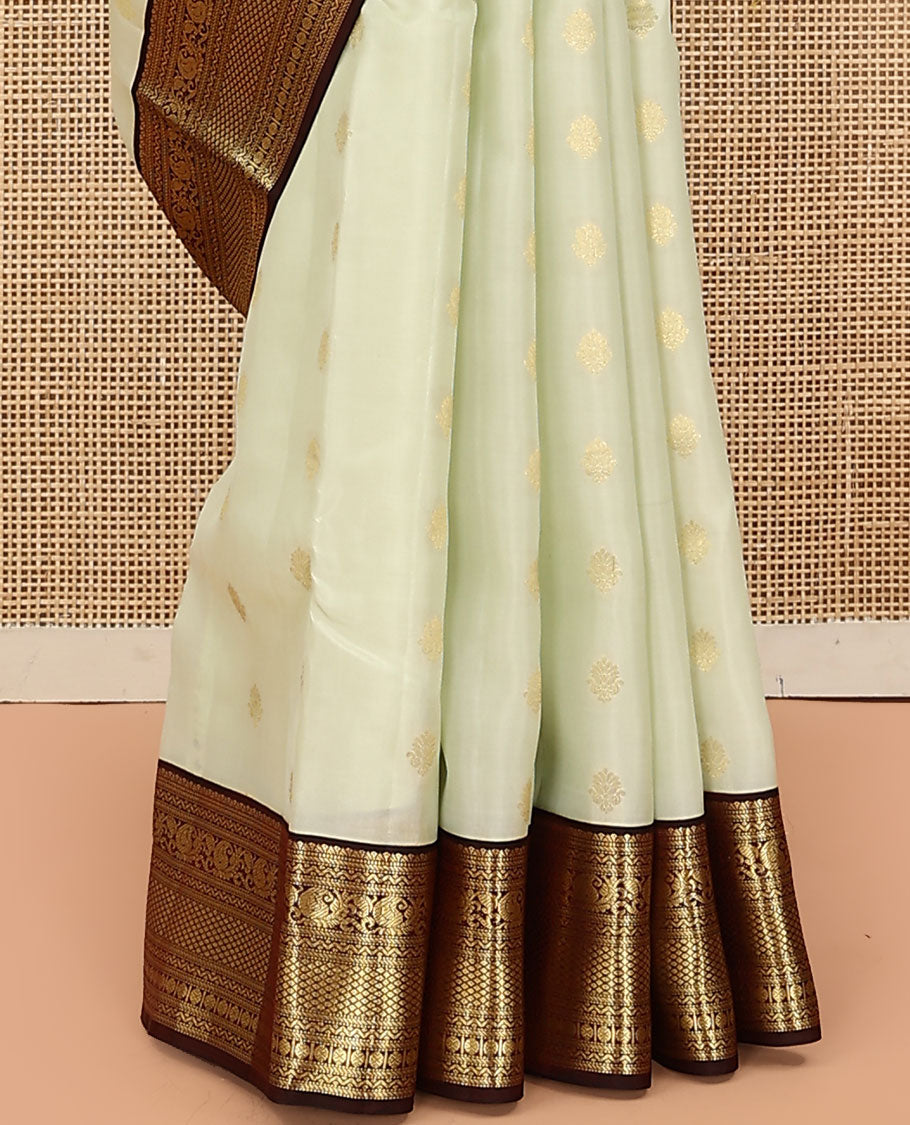 Cream Vasundhara Lite Silk Mix Saree, Enthralled with Zari Buttas on Its Body, Complemented by Contrast Border of Muthu, Banaras, Neli, Manga, Mayil Kann, and Rudraksham Designs, Grand Jaal Pallu, and Paired with a Contrast Blouse