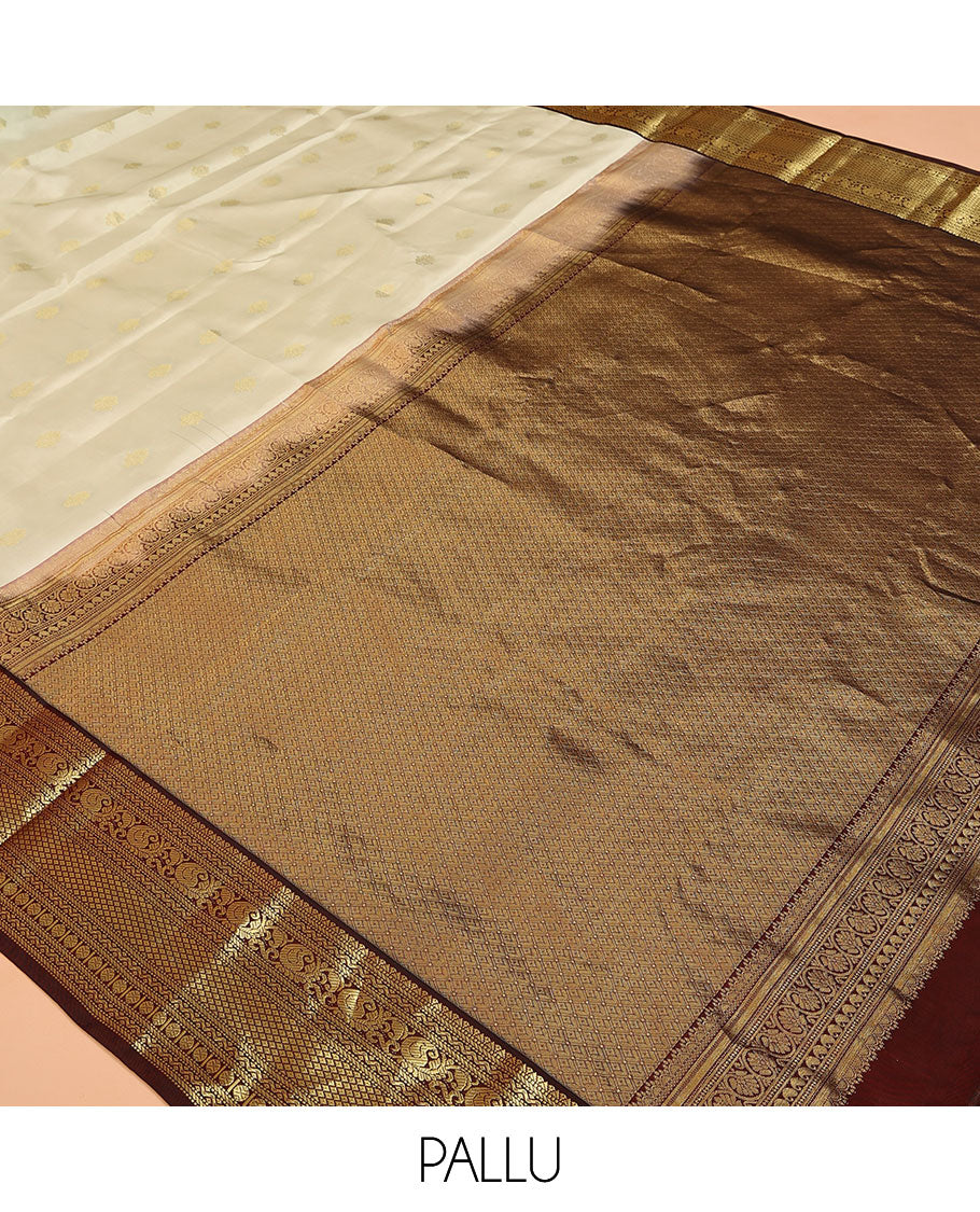 Cream Vasundhara Lite Silk Mix Saree, Enthralled with Zari Buttas on Its Body, Complemented by Contrast Border of Muthu, Banaras, Neli, Manga, Mayil Kann, and Rudraksham Designs, Grand Jaal Pallu, and Paired with a Contrast Blouse