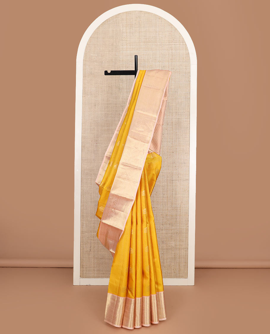 Yellow zari buttas and checked silk saree, contrast border of rekku, muthu, kathir, diamond, rudraksham, and floral designs, and jaal pallu