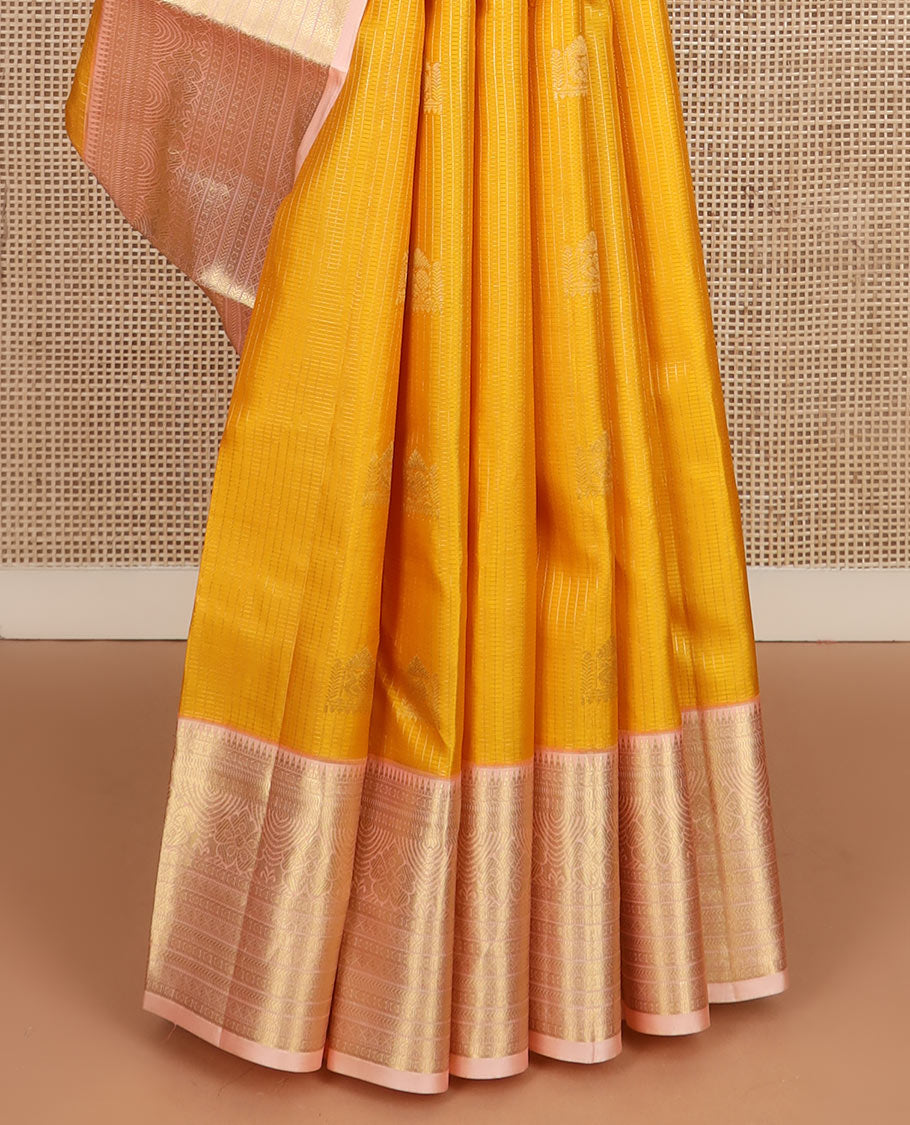 Yellow zari buttas and checked silk saree, contrast border of rekku, muthu, kathir, diamond, rudraksham, and floral designs, and jaal pallu