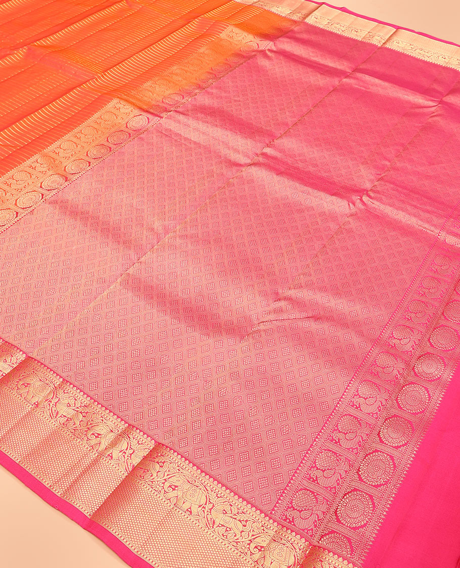 Orange zari striped Vasundhara silk saree, contrast border of thilakam mokku, yaanai, kuthirai, and kuyil kann designs, and jaal pallu