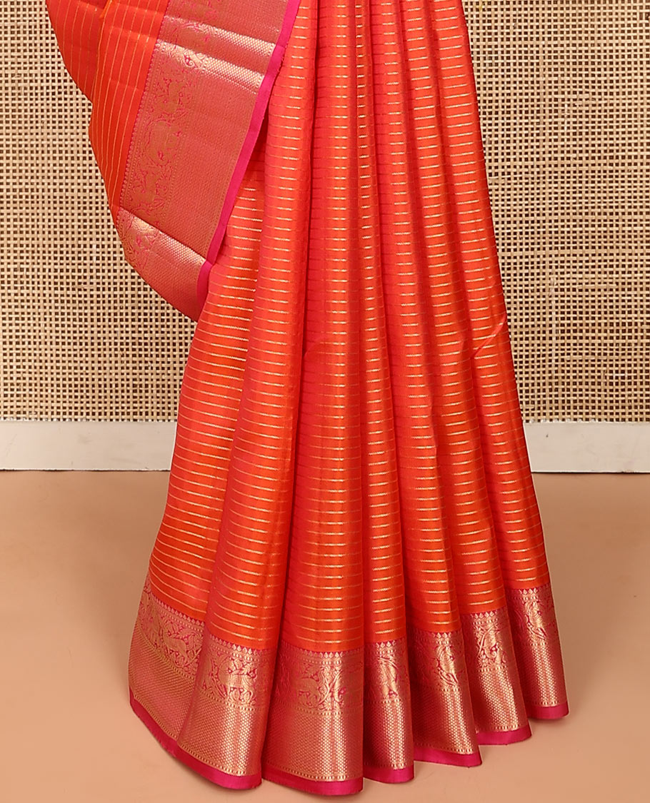 Orange zari striped Vasundhara silk saree, contrast border of thilakam mokku, yaanai, kuthirai, and kuyil kann designs, and jaal pallu
