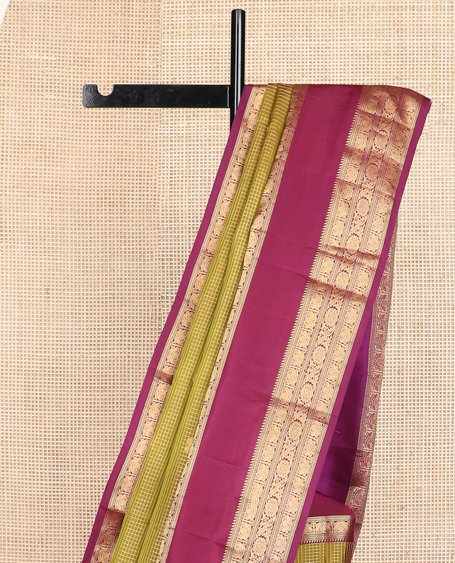 Green micro-checked with annam chakram buttas silk saree, contrast rettai pettu border of ara bogudi, muthu, banaras,iruthalai pakshi and poo chakram, and jaal pallu