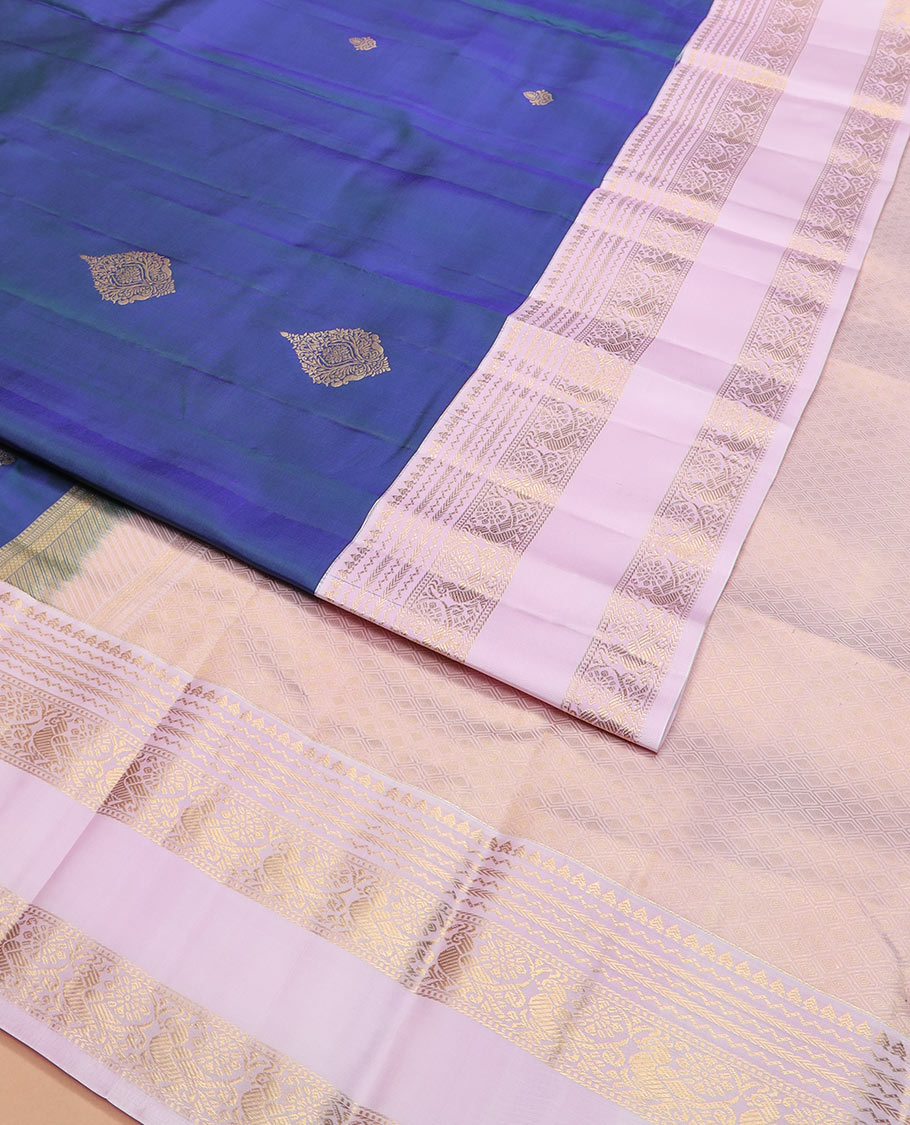 Blue zari buttas silk saree with contrast rettai pettu border of rekku, kathir, and mayil designs, and zari-rich pallu