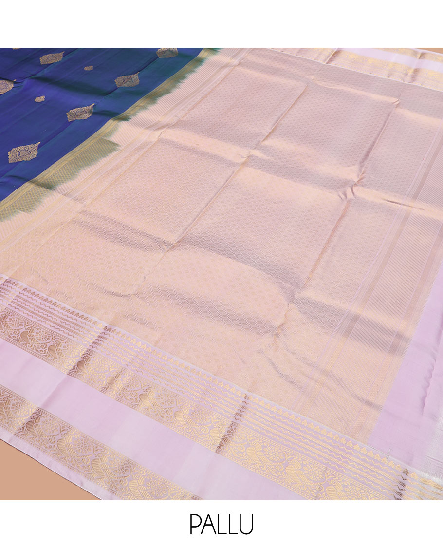 Blue zari buttas silk saree with contrast rettai pettu border of rekku, kathir, and mayil designs, and zari-rich pallu