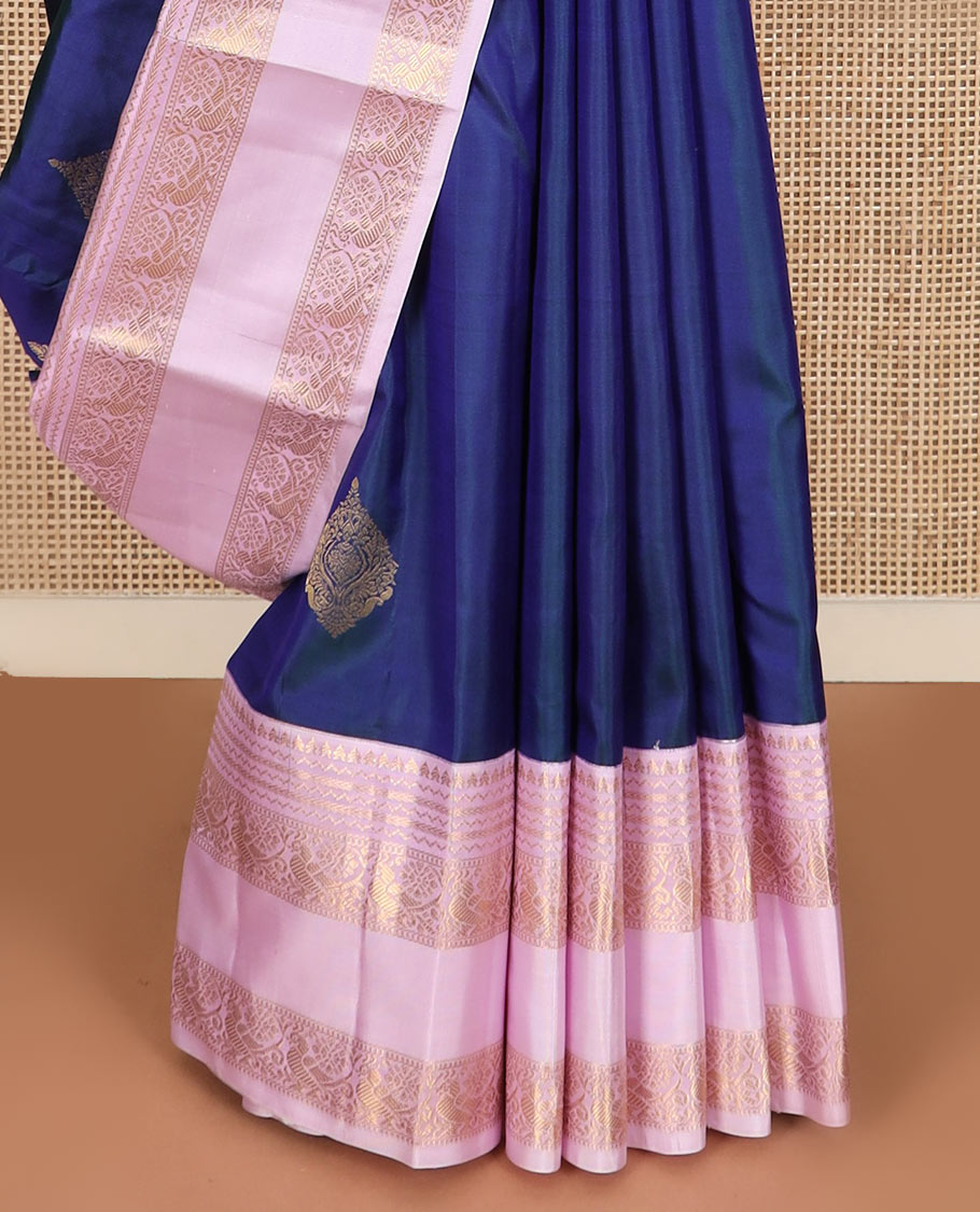 Blue zari buttas silk saree with contrast rettai pettu border of rekku, kathir, and mayil designs, and zari-rich pallu