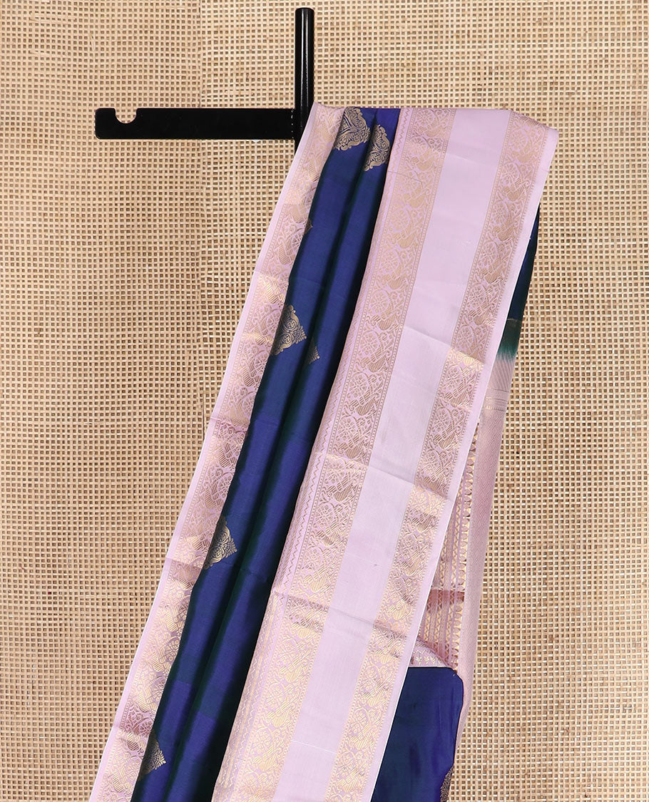 Blue zari buttas silk saree with contrast rettai pettu border of rekku, kathir, and mayil designs, and zari-rich pallu