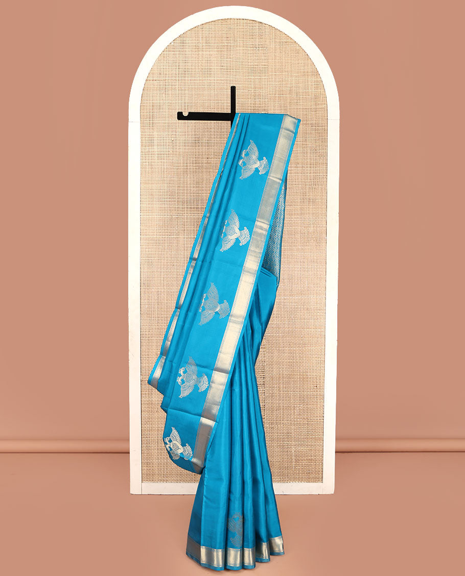 Blue Plain Vasundhara Silk Saree, Highlighted by Zari Border of Iruthalai Pakshi and Traditional Designs, Grand Jaal-Patterned Pallu, and Paired with a Matching Blouse