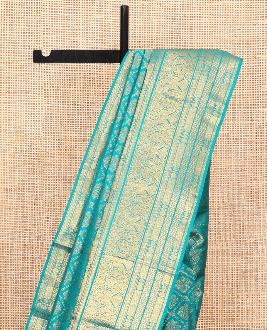 Blue Kanchipuram Wedding Silk Saree, Finely Crafted with Jacquard Design on Its Body, Highlighted by Zari Border of Mayil Kann, Rudraksham, Kamalam, and Iruthalai Pakshi Designs, Intricately Designed Pallu, and Paired with a Matching Blouse