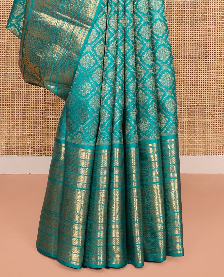 Blue Kanchipuram Wedding Silk Saree, Finely Crafted with Jacquard Design on Its Body, Highlighted by Zari Border of Mayil Kann, Rudraksham, Kamalam, and Iruthalai Pakshi Designs, Intricately Designed Pallu, and Paired with a Matching Blouse