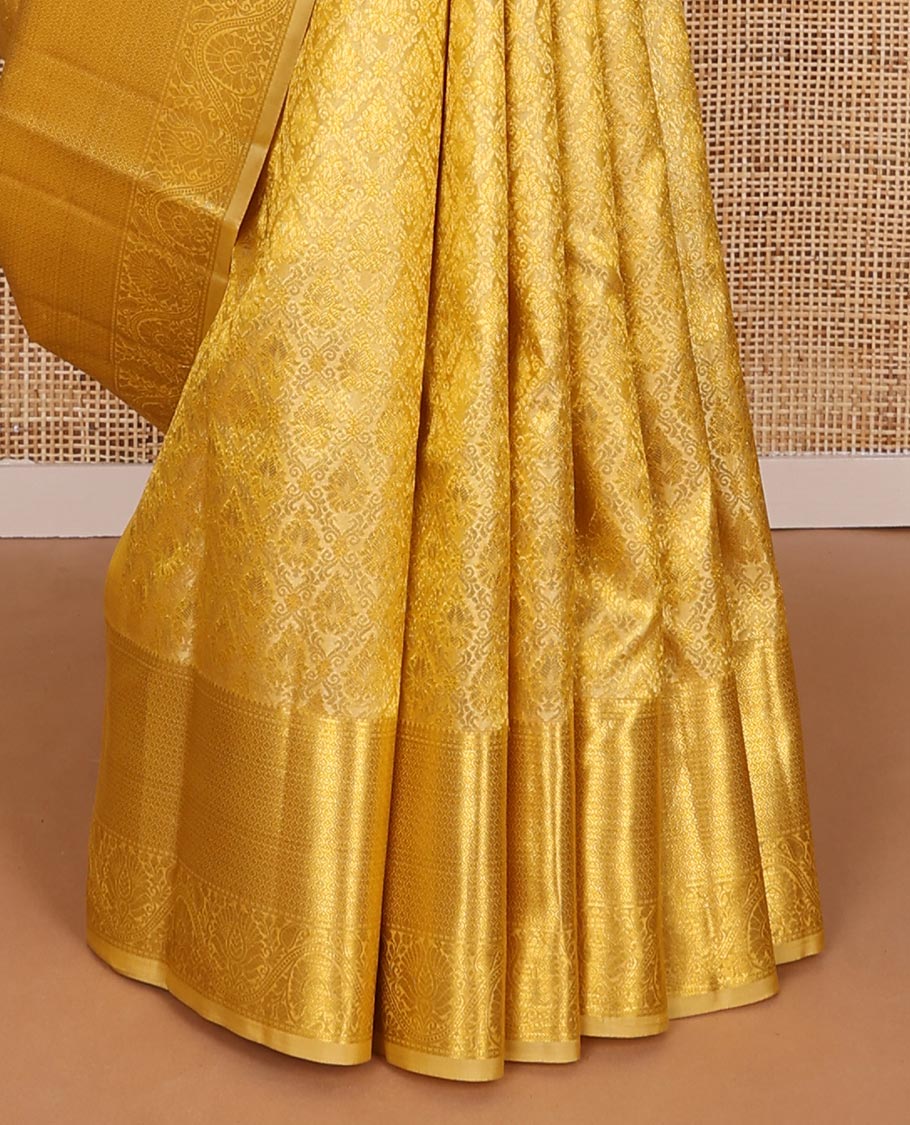 Yellow jacquard kanchipuram wedding silk saree, zari border of traditional design & pallu of floral motif enclosed jaal design