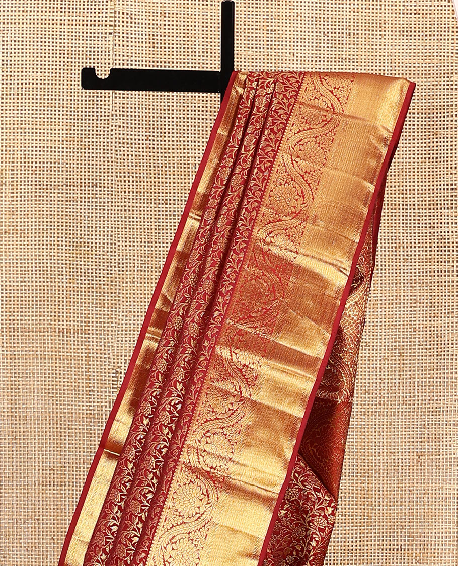 Red jacquard kanchipuram silk saree, zari border of thilakam, kathir, muthu, and dhavana kodi designs, and butta enclosed jaal pallu